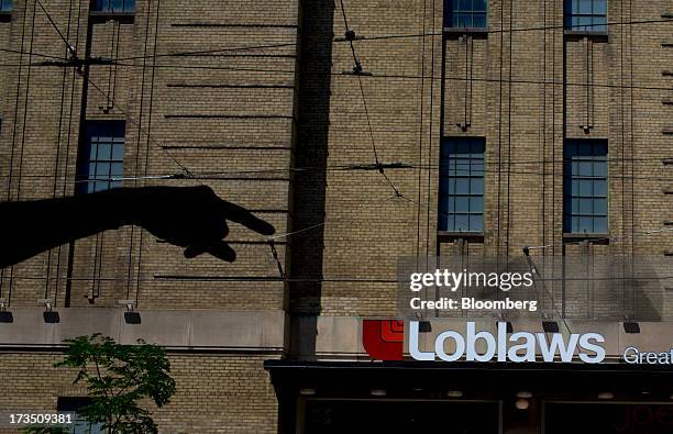 Loblaw Cos. Store stands in Toronto, Ontario, Canada, on Monday, July 15, 2013. Loblaw Cos. Agreed to buy Shoppers Drug Mart Corp. For C$12.4 billion...