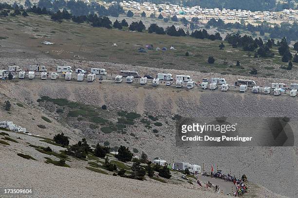 Campers clutter the slopes of the mountin as they await the cyclists during stage fifteen of the 2013 Tour de France, a 242.5KM road stage from...
