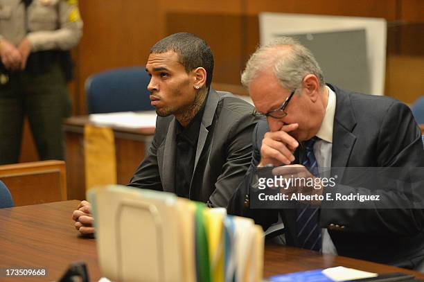 Recording artist Chris Brown and attorney Mark Geragow during Brown's court appearance on July 15, 2013 in Los Angeles, California. Brown appeared in...