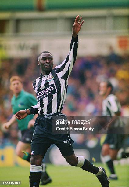 English footballer Andrew Cole of Newcastle United, celebrates his goal against Aston Villa during an English Premier League match at Villa Park,...