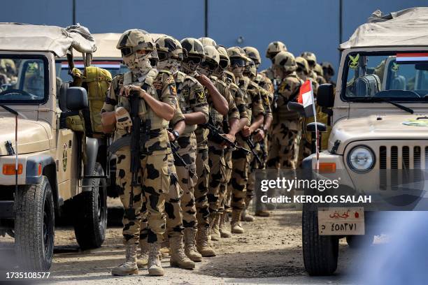 Egyptian army special forces soldiers deploy before the concrete barrier marking the border between Egypt and the Gaza Strip in Rafah in the east of...