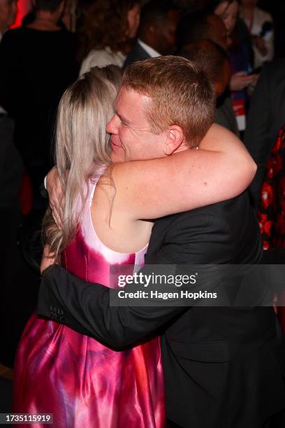 New Zealand Prime Minister and Labour leader Chris Hipkins hugs a former staff member during a Labour Party election night event at Lower Hutt Events...