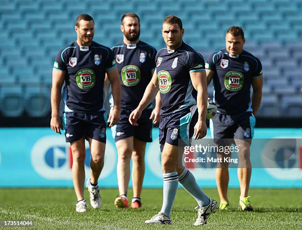 Blues captain Robbie Farah warms up with Blues players during a New South Wales Blues State of Origin training session at ANZ Stadium on July 16,...