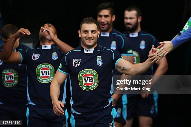 Blues captain Robbie Farah leads the team out during a New South Wales Blues State of Origin training session at ANZ Stadium on July 16, 2013 in...
