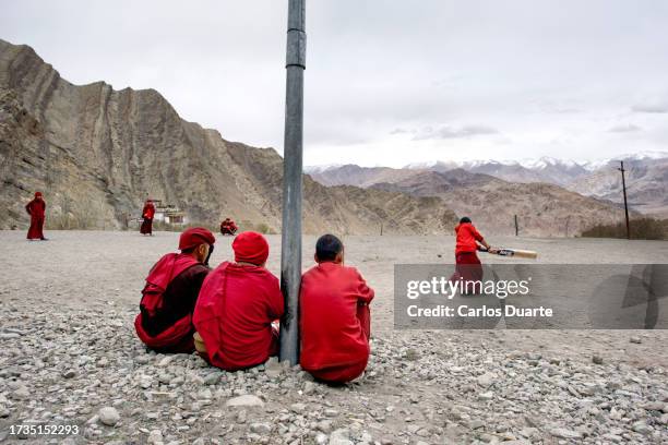 buddhist monks play cricket next to the hemis monastery near the city of leh in ladakh. india. - kargil stock pictures, royalty-free photos & images