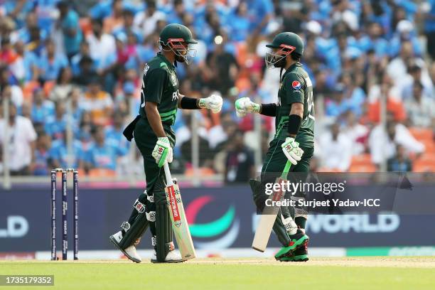 Babar Azam embraces Mohammad Rizwan of Pakistan during the ICC Men's Cricket World Cup India 2023 between India and Pakistan at Narendra Modi Stadium...