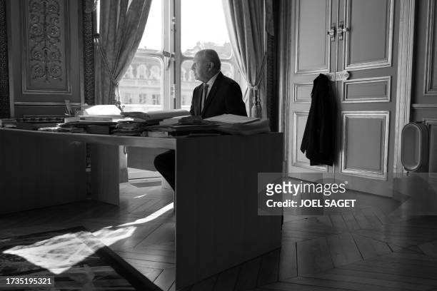 President of the French Constitutional Council Laurent Fabius, poses in his office during a photo session in Paris on October 19, 2023