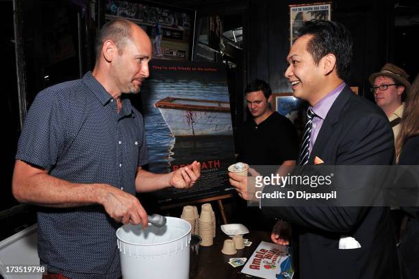 Writer Brian D. Smith serves Ample Hills Creamery ice cream to producer Peter Phok during the Glass Eye Pix "Beneath" Premiere Event - After Party at...