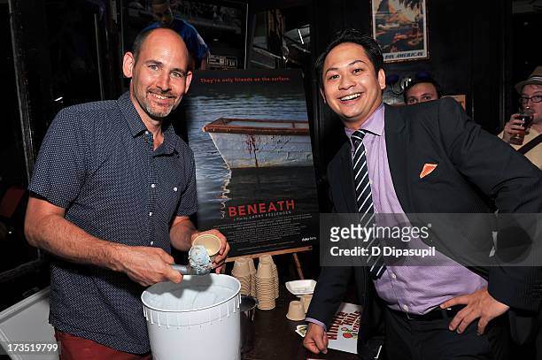 Writer Brian D. Smith serves Ample Hills Creamery ice cream to producer Peter Phok during the Glass Eye Pix "Beneath" Premiere Event - After Party at...