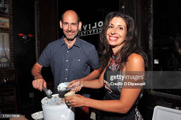 Writer Brian D. Smith and wife Jackie Cuscuna serve Ample Hills Creamery ice cream during the Glass Eye Pix "Beneath" Premiere Event - After Party at...