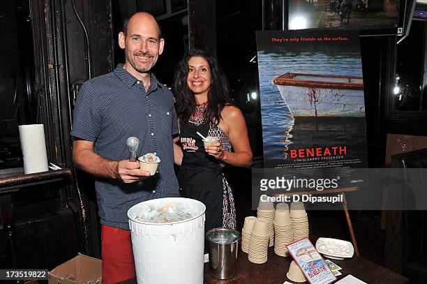 Writer Brian D. Smith and wife Jackie Cuscuna serve Ample Hills Creamery ice cream during the Glass Eye Pix "Beneath" Premiere Event - After Party at...