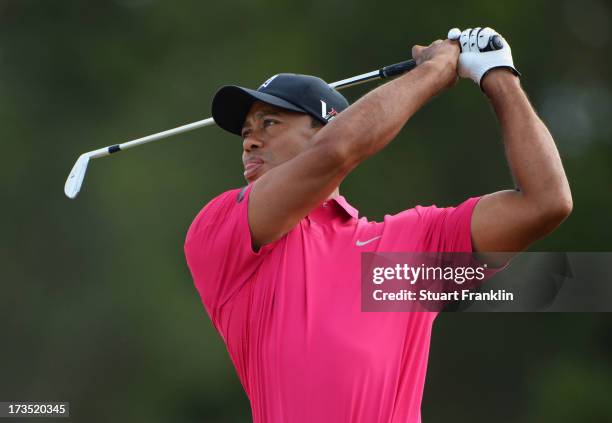 Tiger Woods of the United States hits a shot ahead of the 142nd Open Championship at Muirfield on July 16, 2013 in Gullane, Scotland.