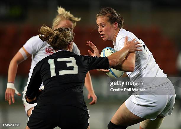 Emily Scarratt of England fends off Claire Richardson of the Black Ferns during game two of the international series between the New Zealand Black...