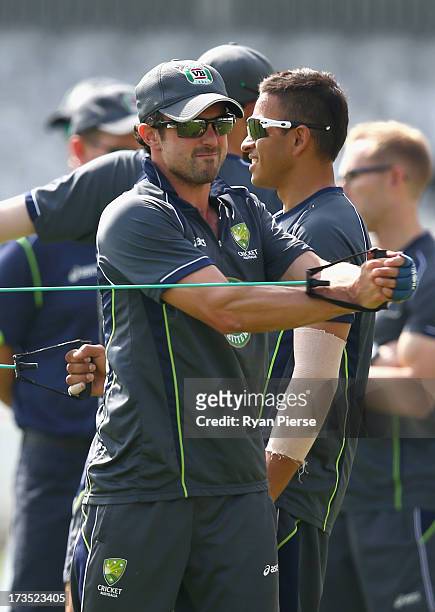 Ed Cowan of Australia and Usman Khawaja of Australia warm up during an Australian Nets Session at Lord's Cricket Ground on July 16, 2013 in London,...