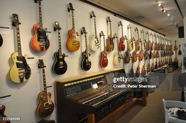 Gibson Les Paul guitars line the wall of an auction house on June 9, 2012.