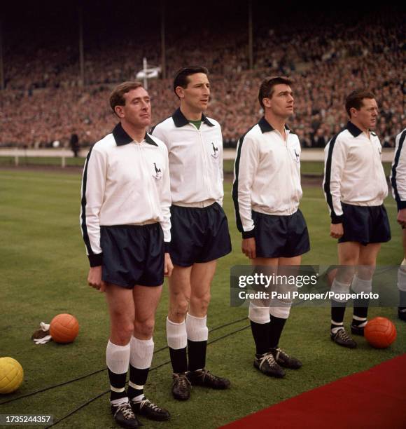 Tottenham Hotspur footballers Danny Blanchflower, Bill Brown, Ron Henry and Les Allen line-up before the FA Cup final between Tottenham Hotspur and...