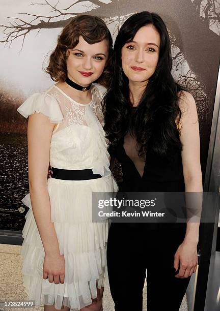 Actresses Joey King and Hayley McFarland arrive at the premiere of Warner Bros. "The Conjuring" at the Cinerama Dome on July 15, 2013 in Los Angeles,...