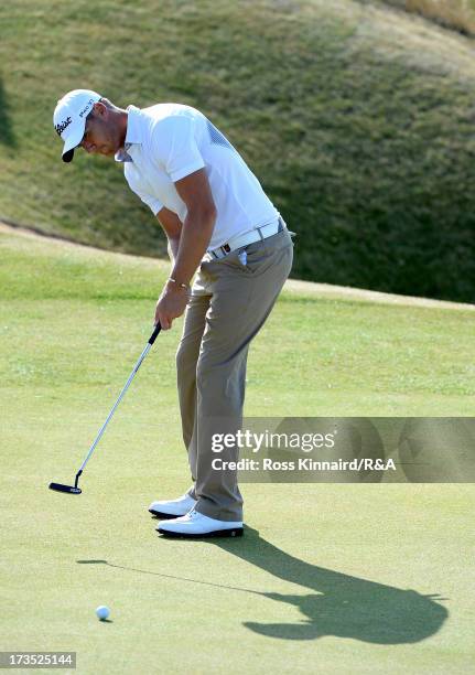 Lloyd Saltman of Scotland putts on the 13th green ahead of the 142nd Open Championship at Muirfield on July 16, 2013 in Gullane, Scotland.