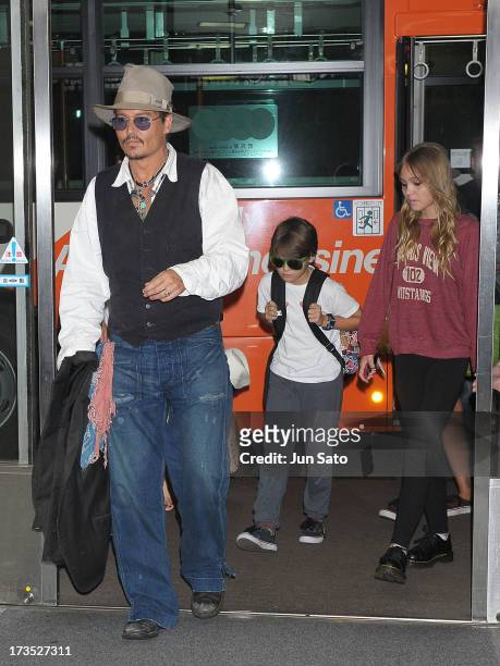 Johnny Depp, Jack Depp and Lily Rose Melody Depp arrive at Narita International Airport on July 16, 2013 in Narita, Japan.