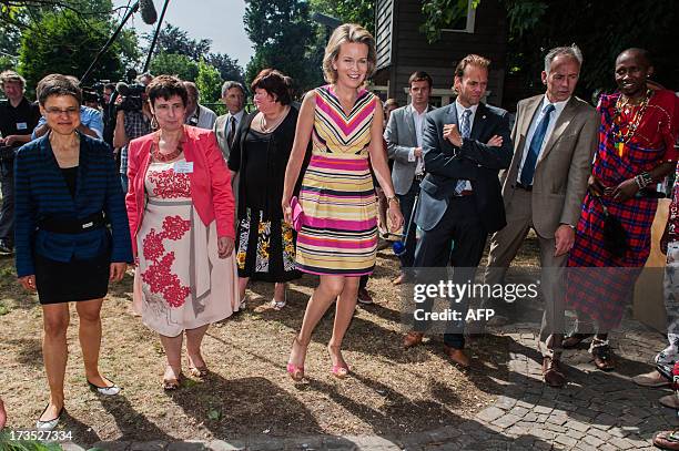 Antwerp Province Governor Cathy Berx and Princess Mathilde of Belgium visit on July 16, 2013 the House of Colors, a shelter for youths and children...