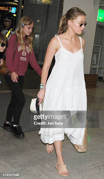 Jack Depp, Lily Rose Melody Depp and Amber Heard arrive at Narita International Airport on July 16, 2013 in Narita, Japan.