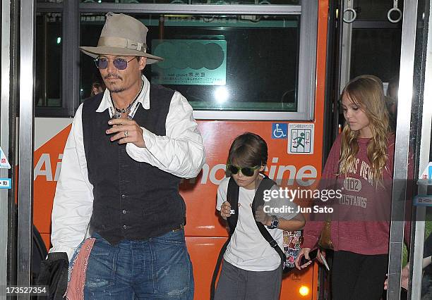 Johnny Depp, Jack Depp and Lily Rose Melody Depp arrive at Narita International Airport on July 16, 2013 in Narita, Japan.