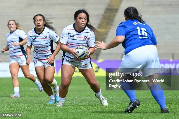 Freda Tafuna of the United States runs with the ball whilst under pressure from Sosoli Talawadua of Samoa during the WXV 2 Match between United...