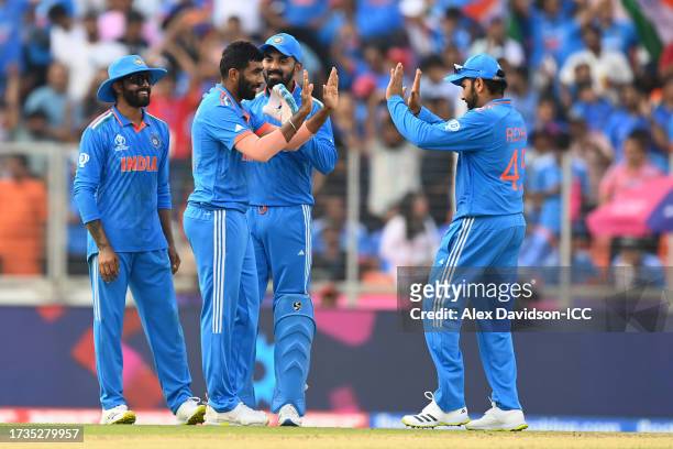 Jasprit Bumrah of India celebrates the wicket of Shadab Khan of Pakistan during the ICC Men's Cricket World Cup India 2023 between India and Pakistan...