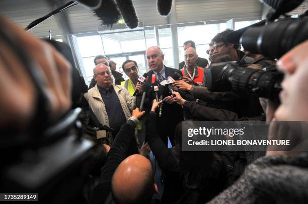 French Secretary of State for Transport Dominique Bussereau answers journalists' questions at the Roissy-Charles de Gaulle airport, outside Paris, on...