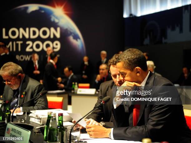 President Barack Obama and Treasury Secretary Timothy Geithner take part in a round table meeting in London on April 2, 2009 during the G20 summit....