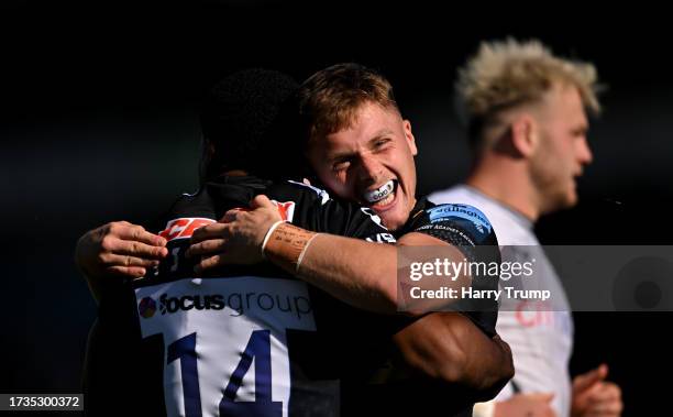 Immanuel Feyi-Waboso of Exeter Chiefs celebrates their sides first try with team mate Tom Cairns during the Gallagher Premiership Rugby match between...