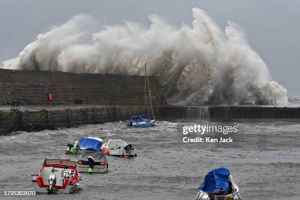 Waves break over Dysart harbour wall during storm Babet, on October 20 in Kirkcaldy, Scotland.