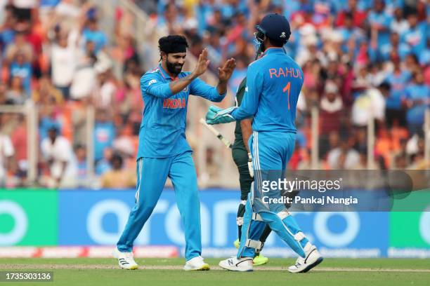 Ravindra Jadeja of India celebrates a wicket of Hasan Ali of Pakistan during the ICC Men's Cricket World Cup India 2023 between India and Pakistan at...