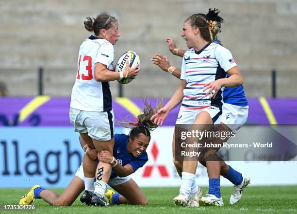 Kate Zackary of the United States is tackled by Hope Schuster of Samoa during the WXV 2 Match between United States and Samoa at The Danie Craven...