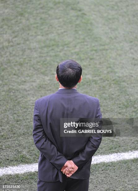 North Korea's coach Kim Jong-Hun watches his players during the Group G first round 2010 World Cup football match Ivory Coast versus North Korea on...