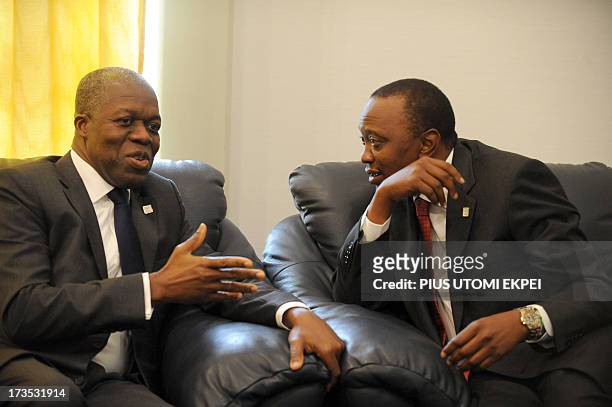 Ghana's Vice President Kwesi Amissah-Arthur discusses with Kenyan President Uhuru Kenyatta during a private meeting at the African Union Summit on...