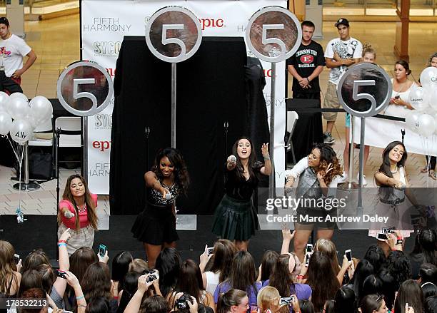Fifth Harmony performs at the Square One Mall on July 15, 2013 in Saugus, Massachusetts.