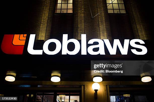 Loblaw Cos. Store stands in Toronto, Ontario, Canada, on Monday, July 15, 2013. Loblaw Cos. Agreed to buy Shoppers Drug Mart Corp. For C$12.4 billion...