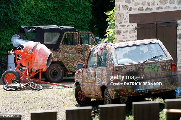 Photo taken on July 16, 2013 shows cars parked outside the house of Norwegian neo-Nazi black metal rocker and convicted killer, Kristian Vikernes, in...