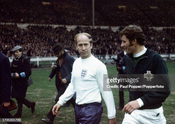 England captain Bobby Charlton with Northern Ireland's Terry Neill as they walk out before the British Home Championship match between England and...