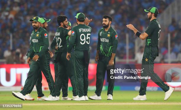 Hasan Ali of Pakistan celebrates the ticket of Virat Kohli of India during the ICC Men's Cricket World Cup India 2023 between India and Pakistan at...