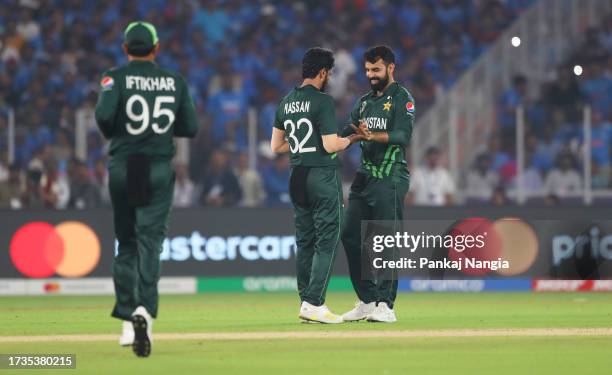 Hasan Ali of Pakistan celebrates the ticket of Virat Kohli of India during the ICC Men's Cricket World Cup India 2023 between India and Pakistan at...