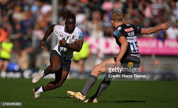 Rotimi Segun of Saracens is tackled by Josh Hodge of Exeter Chiefs during the Gallagher Premiership Rugby match between Exeter Chiefs and Saracens at...