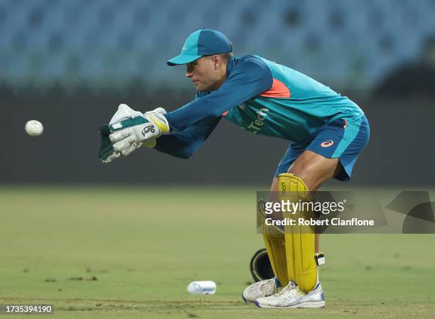 Alex Carey of Australia takes the ball during an Australian training session at the ICC Men's Cricket World Cup India 2023 at the BRSABVE Cricket...