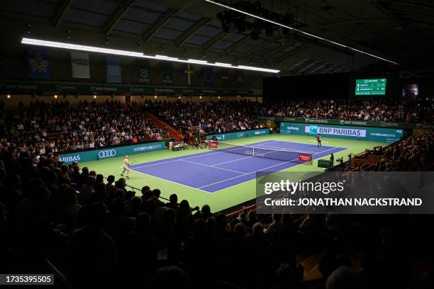 France's Gael Monfils returns the ball to France's Adrian Mannarino during their men's singles match of the Nordic Open tennis tournament in...