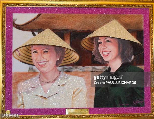 Picture shows a portrait of US Secretary of State Hillary Clinton and her daughter Chelsea by Vietnamese artist is Dao Trong Cuong that Clinton was...