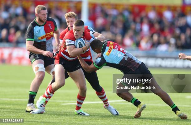 Seb Atkinson of Gloucester is tackled by Will Joseph of Harlequins during the Gallagher Premiership Rugby match between Gloucester Rugby and...