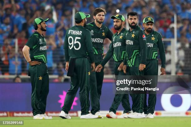 Pakistan players celebrate the wicket of Rohit Sharma of India during the ICC Men's Cricket World Cup India 2023 between India and Pakistan at...