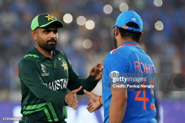 Babar Azam of Pakistan shakes hands with Rohit Sharma of India after India beat Pakistan during the ICC Men's Cricket World Cup India 2023 between...