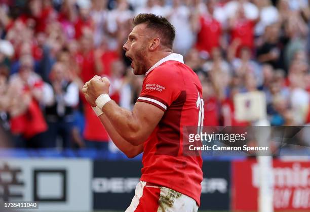 Dan Biggar of Wales celebrates scoring his team's first try during the Rugby World Cup France 2023 Quarter Final match between Wales and Argentina at...